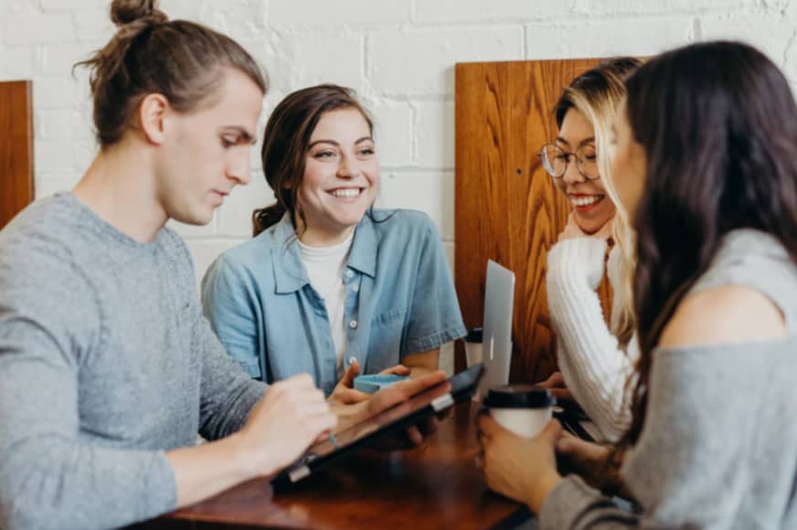 A group of friends at a coffee shop photo
